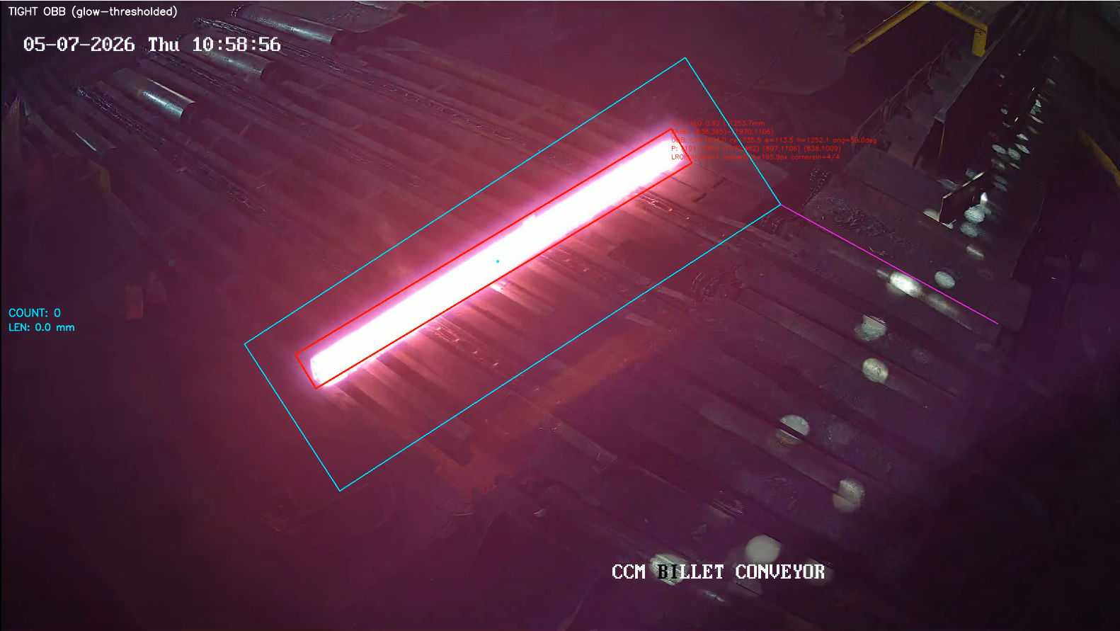 Glowing hot steel billet identified by an oriented detection outline within a defined conveyor-monitoring region.